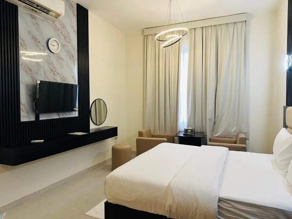 Bright modern guest room at Al Zahra Hotel Apartments